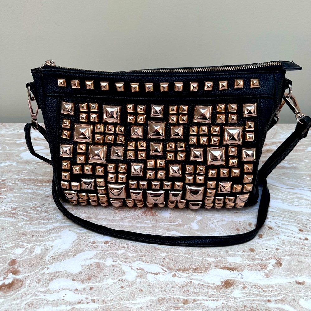 Black & gold cross body with adjustable strap. MMS design studio